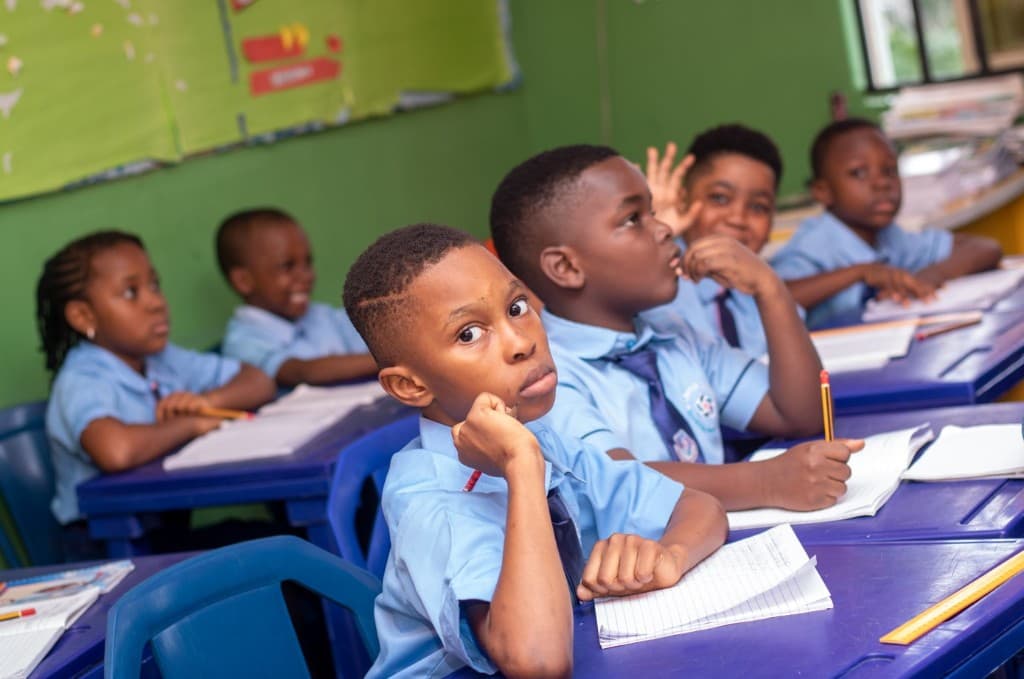 Learner focused at a desk during independent classwork in Thembisa, Midrand.